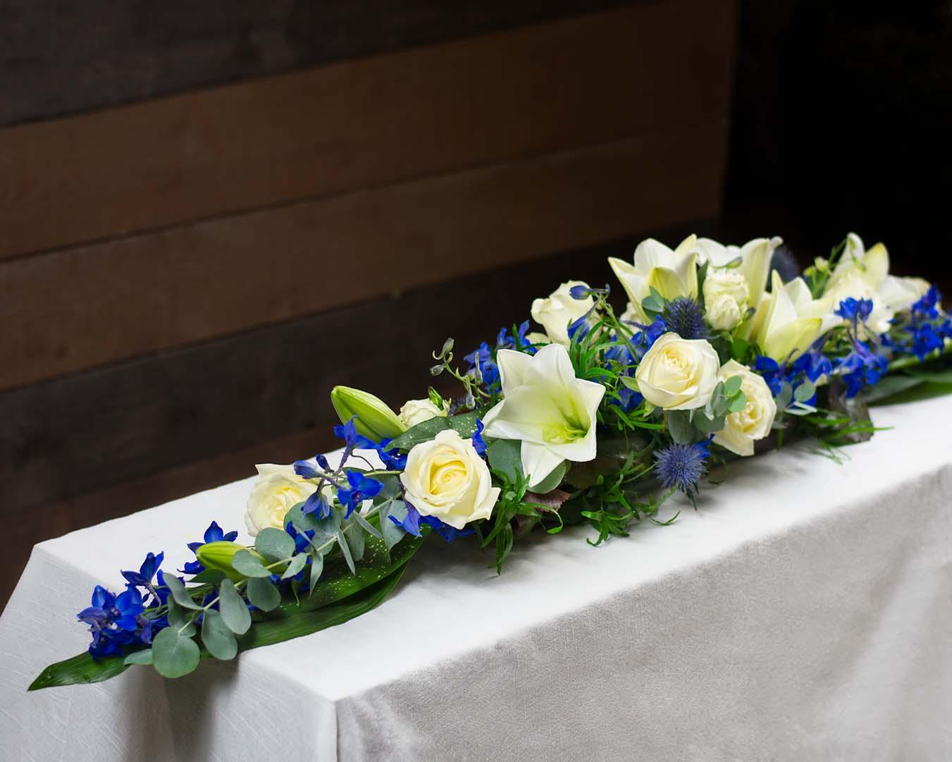 <a href="https://www.laajasalonkukkapalvelu.info/tuote/arkkulaite-lilja/" target="_blank">Arkkulaite Lilja</a>